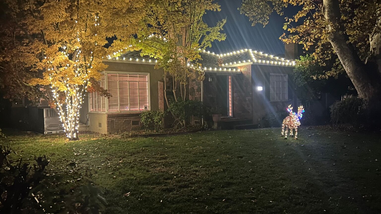 Holiday lighting in Rancho Cordova, CA: farmhouse multicolor dusk